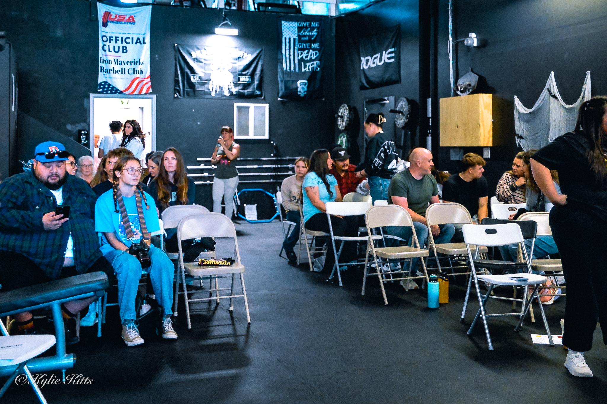 Spectators seated at a USA Powerlifting meet hosted by the Iron Mavericks Barbell Club
